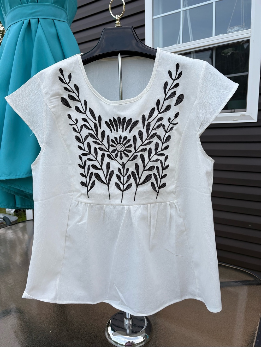 White Embroidered Cap-Sleeve Blouse with Black Floral Motif